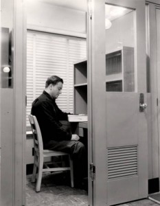 Study carrel and student in the M.D. Anderson Library, from the UH Photographs Collection and available for download through our Digital Library.