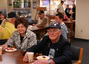 Teresa Reilly, widow of John D. Reilly, with Howard Brooks, former crew member of the USS Houston (CA-30)