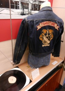 From the exhibit:  Shellac-coated metal record (sent to radio stations as promotional materials for Frontier Fiesta in its heyday) and "Tombstone" jacket