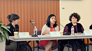 Lisa Cruces (center), Archivists for the Hispanic Collections, addresses a question from the audience during the panel discussion