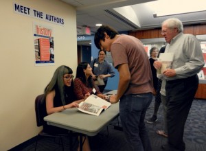 Attendees of the exhibit's opening were able to meet with authors and discuss their research.