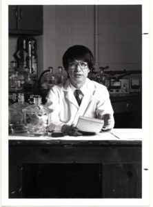 Paul Chu sitting at a lab desk.